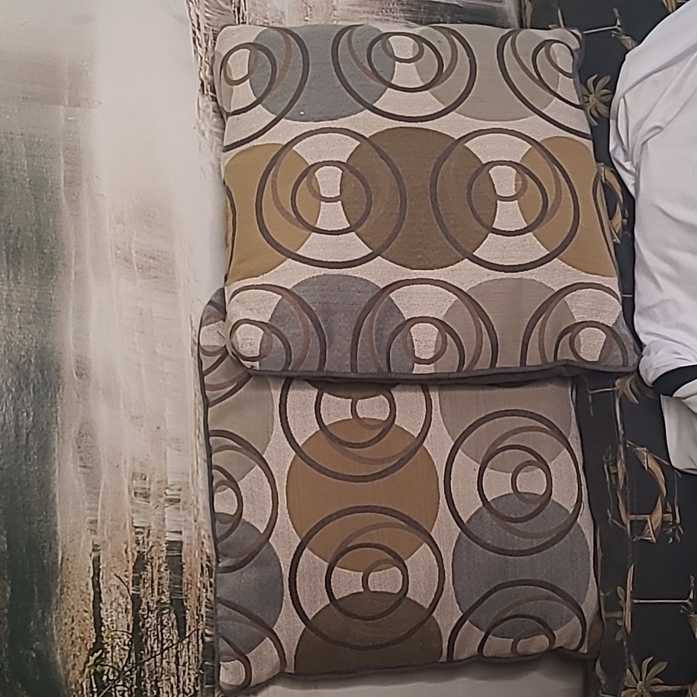Set of 2 decorative throw pillows with warm geometric circle swirl dot design